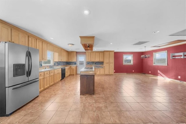 kitchen with a center island, stainless steel fridge with ice dispenser, open floor plan, light countertops, and black dishwasher