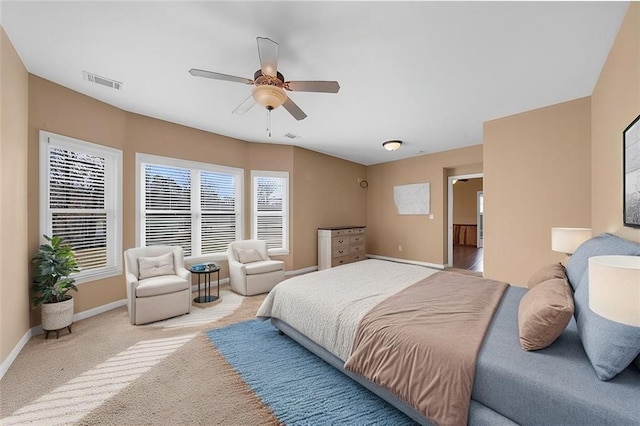 bedroom with visible vents, baseboards, ceiling fan, and carpet flooring