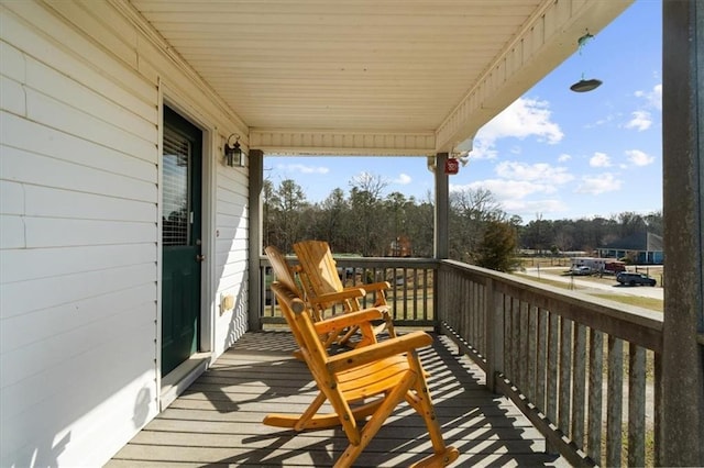 balcony featuring a porch