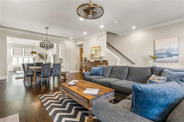 living room with dark wood-type flooring and ornamental molding