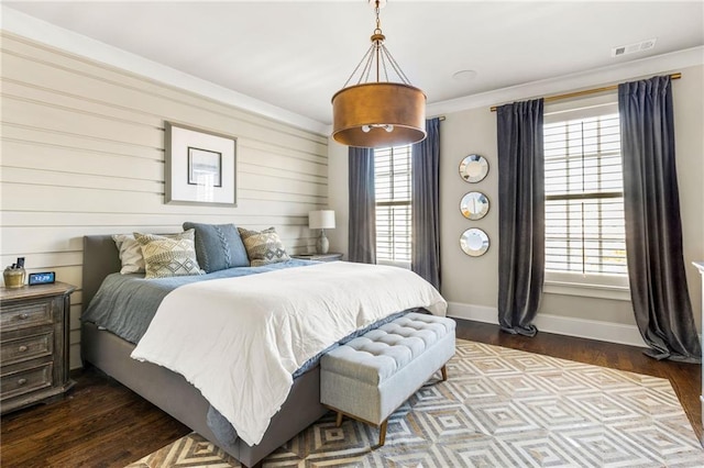 bedroom featuring crown molding and hardwood / wood-style floors