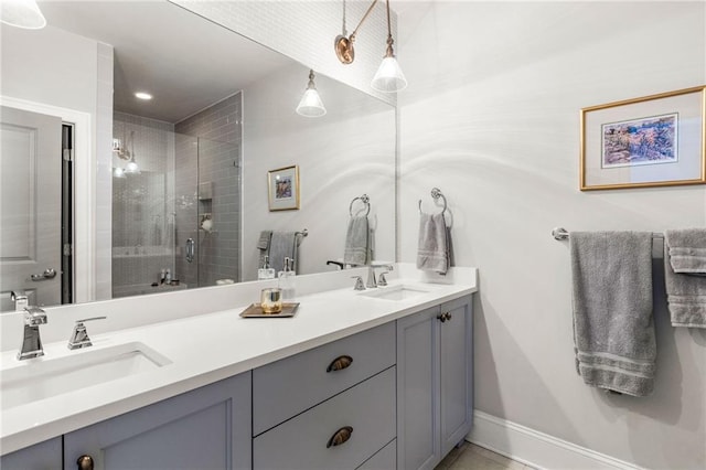 bathroom featuring vanity and a shower with door