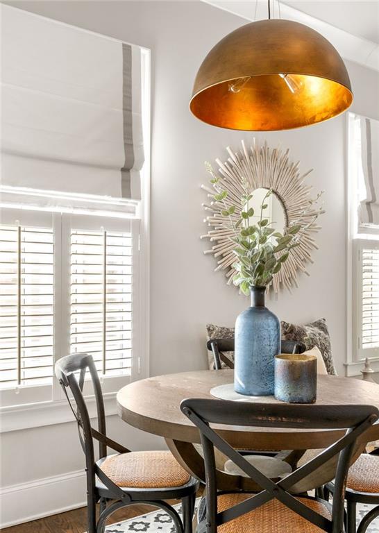 dining space featuring hardwood / wood-style flooring and plenty of natural light