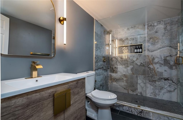 bathroom with vanity, an enclosed shower, tile patterned floors, and toilet