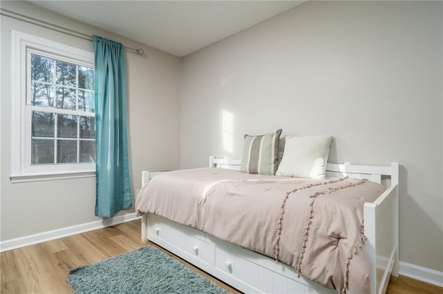 bedroom with hardwood / wood-style floors