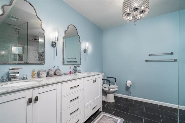 bathroom with a shower with door, vanity, tile patterned floors, toilet, and a chandelier