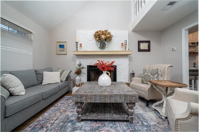 living room featuring vaulted ceiling and dark hardwood / wood-style flooring