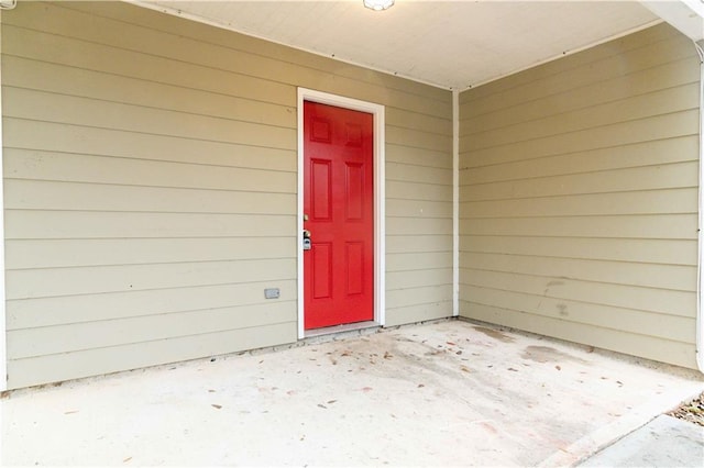 entrance to property with a patio area