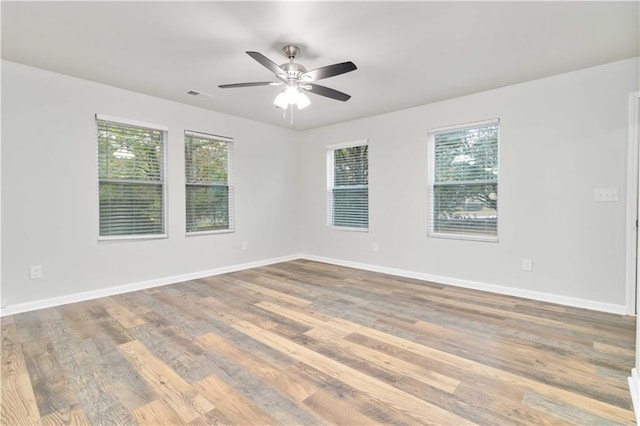 bungalow-style house featuring covered porch, central AC unit, and a front yard