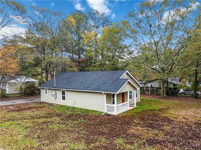 view of side of property with a porch