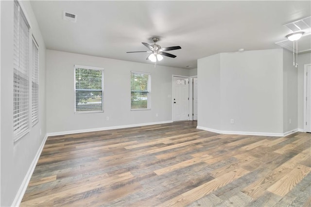 unfurnished room with dark hardwood / wood-style floors and ceiling fan