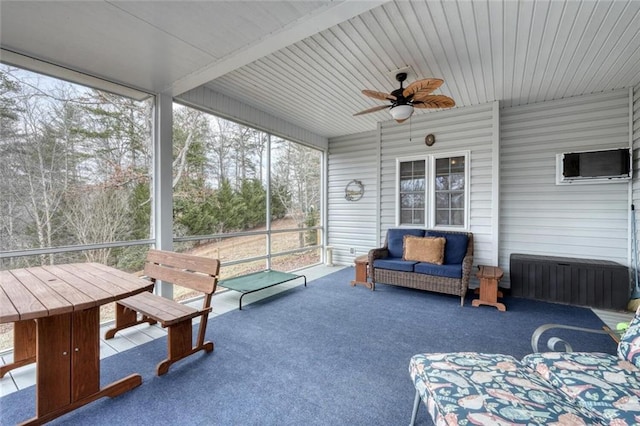 sunroom / solarium with ceiling fan and plenty of natural light