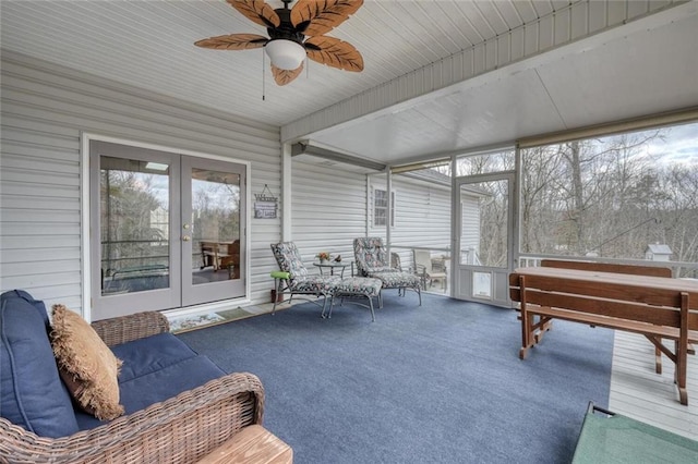 sunroom / solarium featuring french doors and a ceiling fan