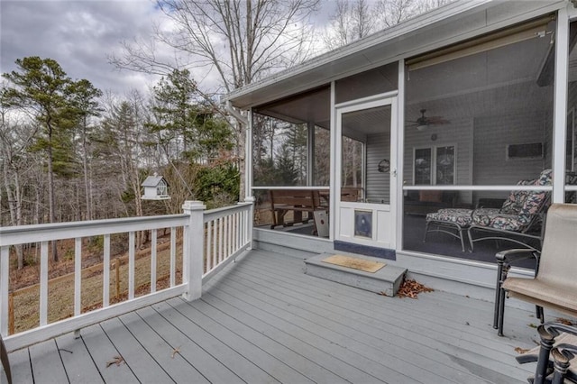 wooden terrace featuring a sunroom