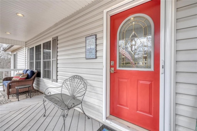view of exterior entry with a porch