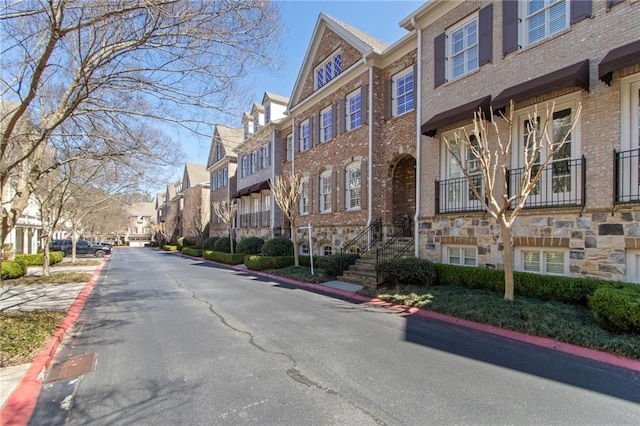 view of street featuring curbs and a residential view