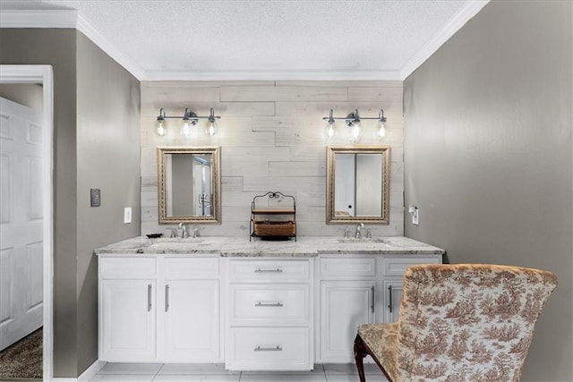 bathroom with vanity, tile patterned floors, and a textured ceiling