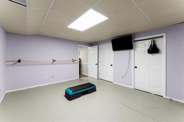 workout room featuring a drop ceiling