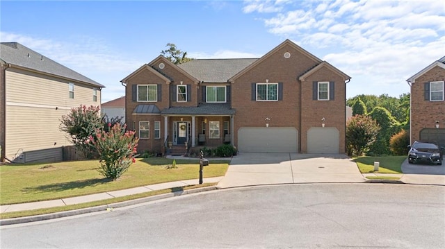 view of front of property featuring a garage and a front lawn