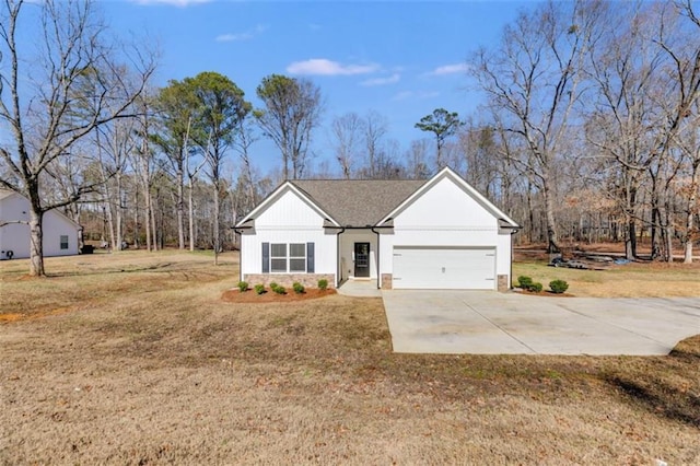 view of front of home with a garage and a front yard