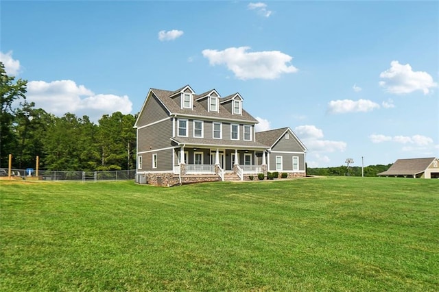 back of house with a porch and a yard