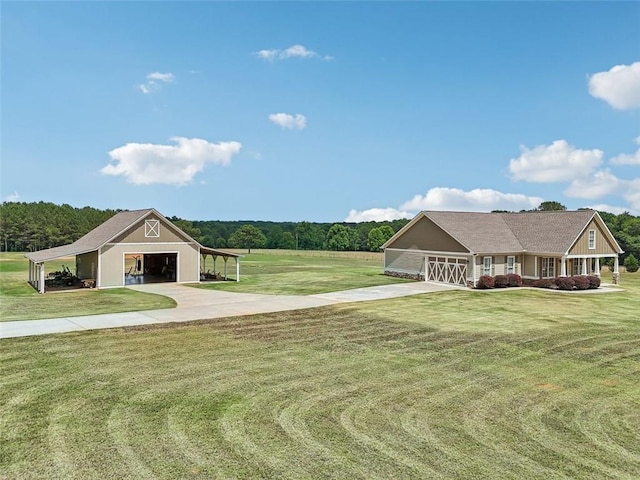 view of front of property featuring a garage, a front yard, and a carport