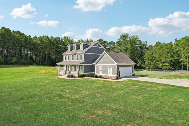 view of front of house with a garage, a front lawn, and a porch