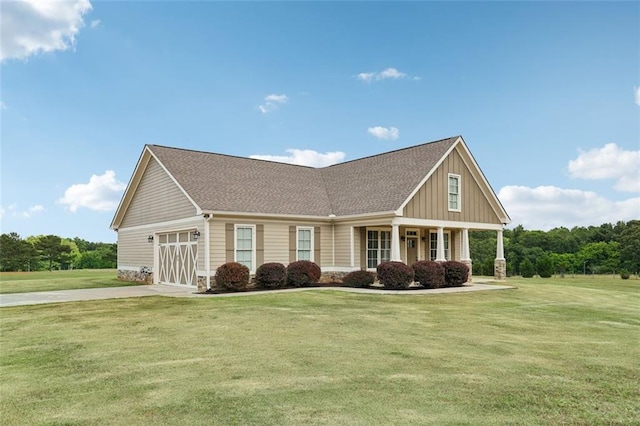 craftsman-style home with covered porch and a front yard