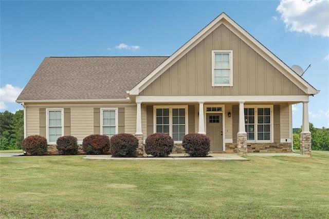 view of front facade with covered porch and a front lawn