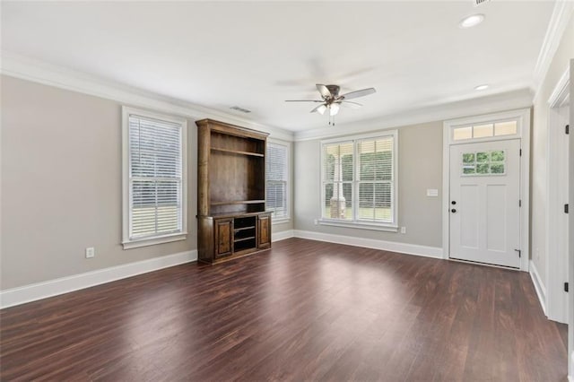 unfurnished living room featuring ceiling fan, ornamental molding, and dark hardwood / wood-style floors