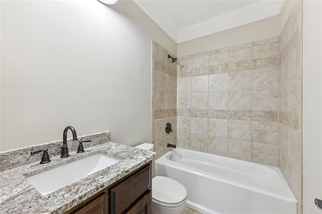 full bathroom featuring tiled shower / bath combo, vanity, crown molding, and toilet