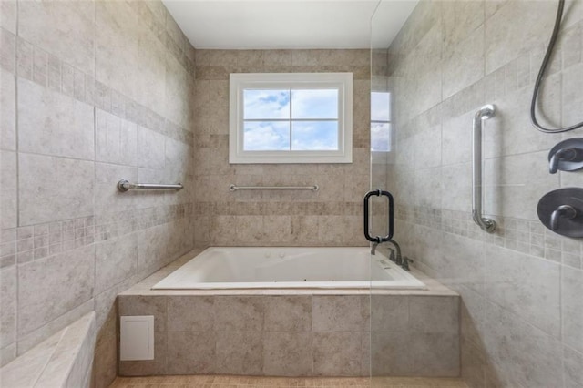 bathroom featuring separate shower and tub and tile walls