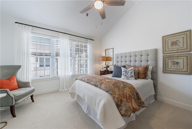 bedroom with light colored carpet, vaulted ceiling, and baseboards