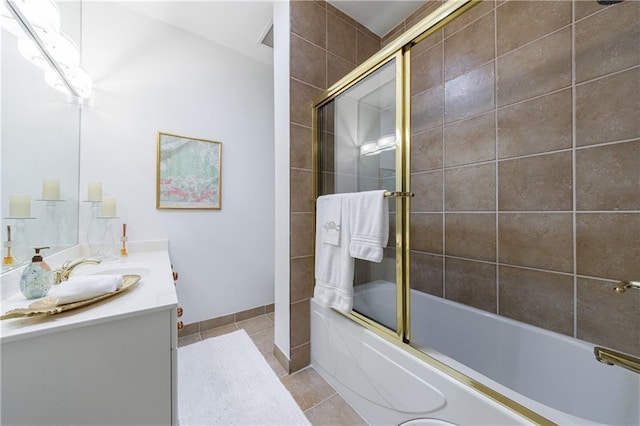 full bathroom with shower / bath combination with glass door, vanity, baseboards, and tile patterned floors