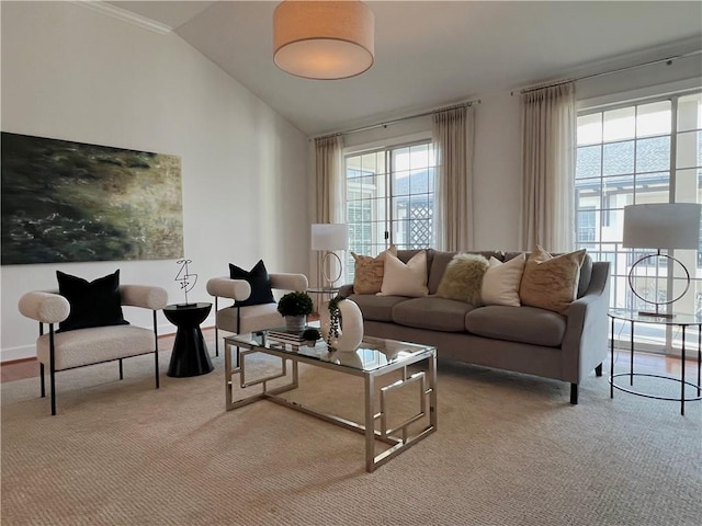 carpeted living room featuring lofted ceiling