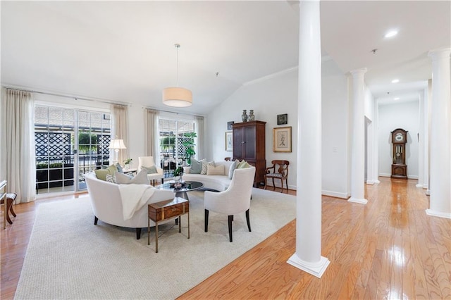 living room featuring lofted ceiling, recessed lighting, baseboards, light wood-type flooring, and decorative columns