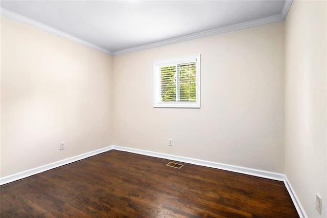 empty room with hardwood / wood-style floors and ornamental molding