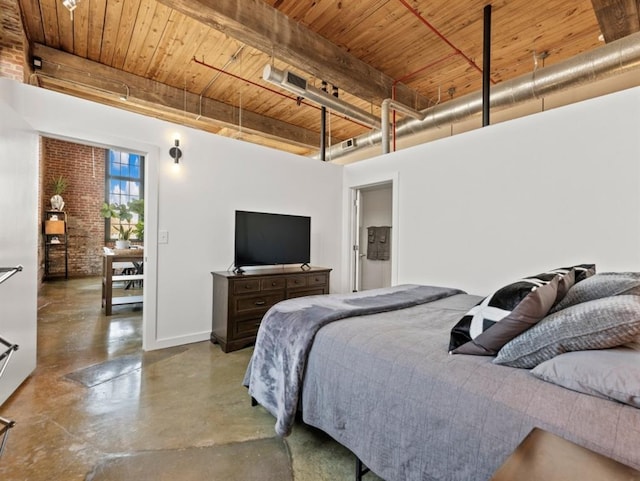 bedroom with brick wall, baseboards, wood ceiling, concrete flooring, and beam ceiling