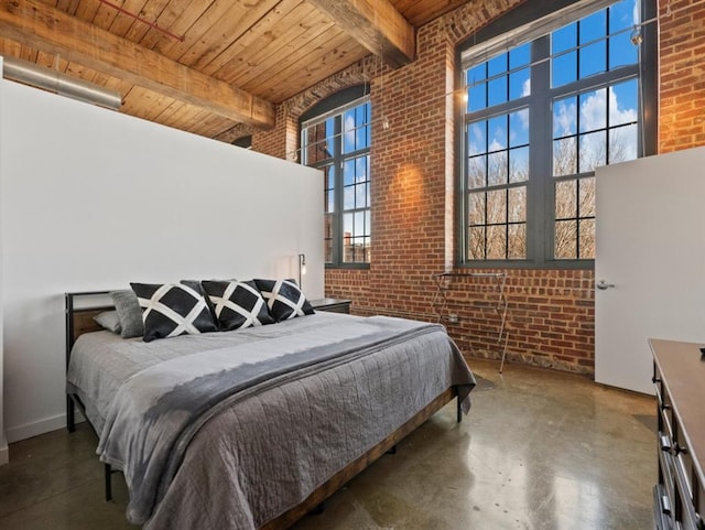 bedroom featuring brick wall, wood ceiling, concrete flooring, beam ceiling, and a high ceiling