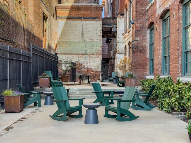 view of patio featuring fence