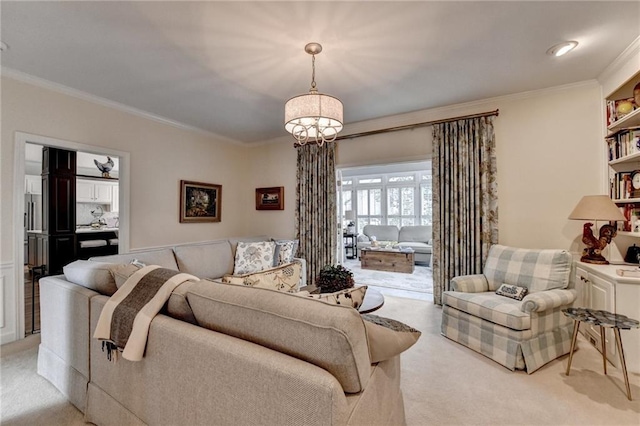 living room featuring a chandelier, light carpet, and crown molding