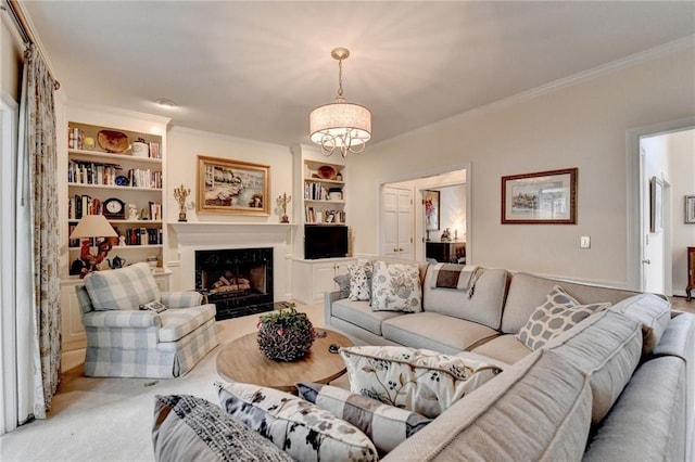 living area with built in shelves, crown molding, an inviting chandelier, a premium fireplace, and light carpet