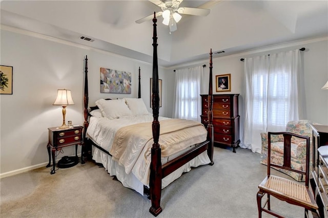 bedroom with baseboards, visible vents, crown molding, and light colored carpet