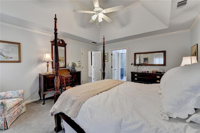 bedroom with baseboards, visible vents, ornamental molding, a tray ceiling, and carpet flooring