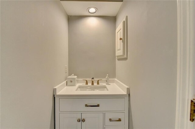 bathroom with a freestanding tub, a shower stall, and vanity