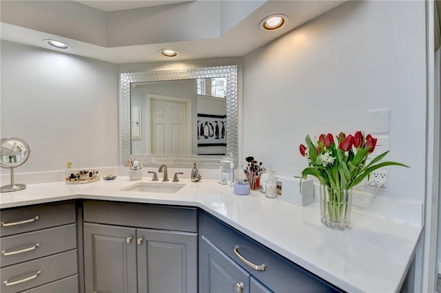 bathroom featuring vanity and recessed lighting