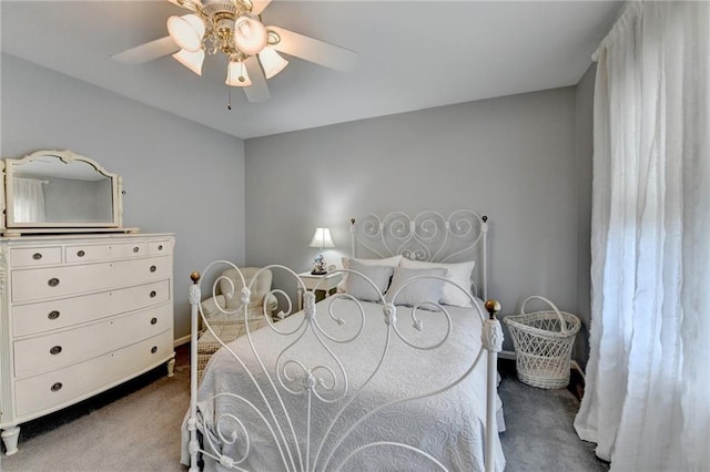 carpeted bedroom featuring a ceiling fan