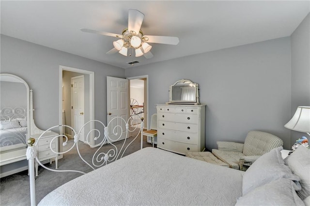 carpeted bedroom featuring visible vents, ceiling fan, and baseboards