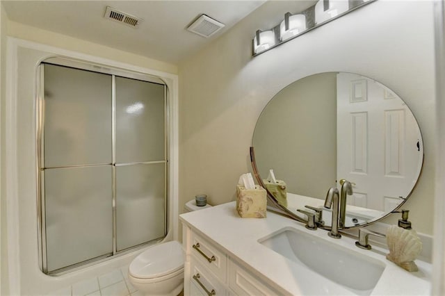 full bathroom featuring toilet, vanity, an enclosed shower, and visible vents