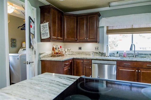 kitchen with washer / clothes dryer, stainless steel dishwasher, a sink, ornamental molding, and light stone countertops